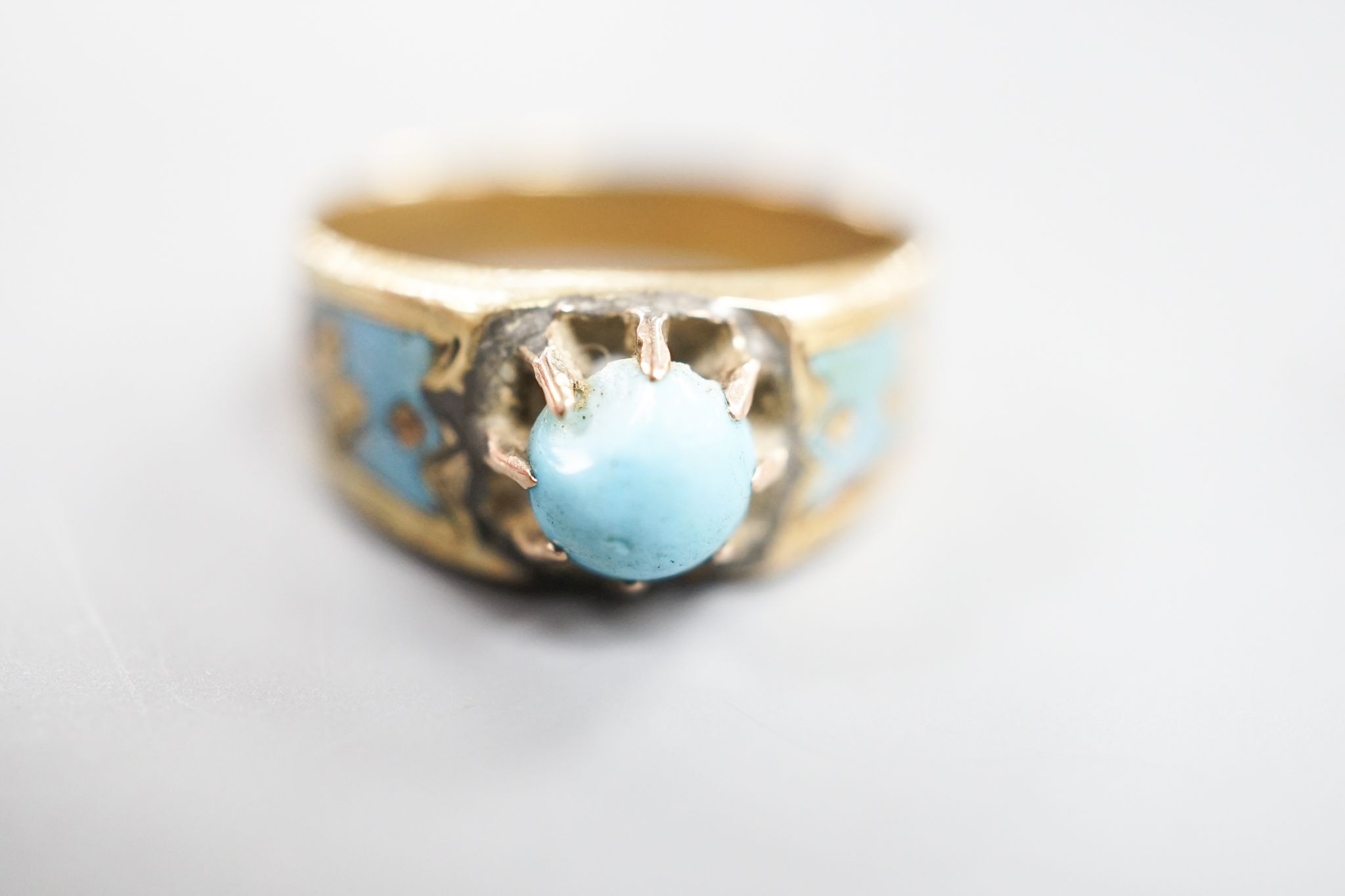 An antique yellow metal, turquoise and enamel set ring, size U/V, and a Victorian yellow metal and turquoise pendant, gross weight 6.3 grams.